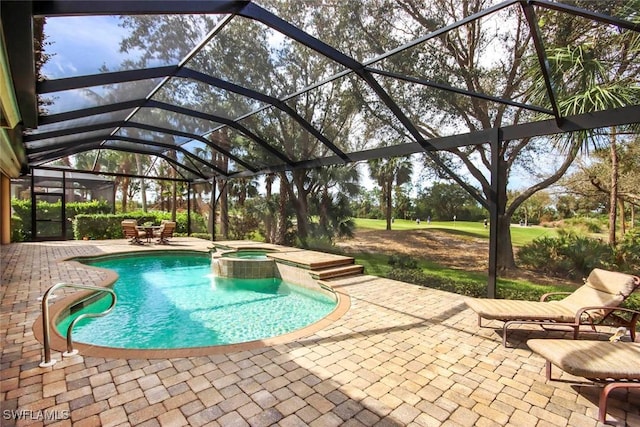 8921 Crown Colony Blvd, Fort Myers, FL 33908 - view of swimming pool featuring a patio area, a pool with connected hot tub, and a lanai