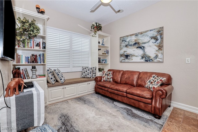 living room featuring ceiling fan