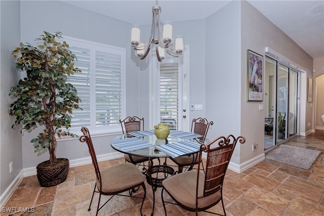 dining space featuring a chandelier