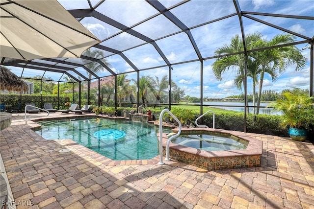 view of swimming pool with a patio area, an in ground hot tub, a water view, and glass enclosure