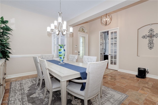 dining area with a notable chandelier