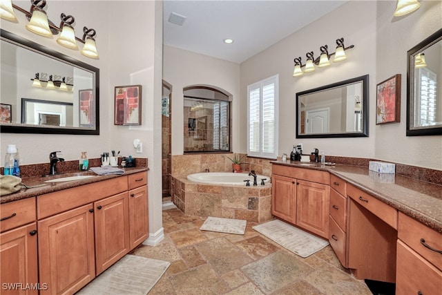 bathroom with vanity and plus walk in shower