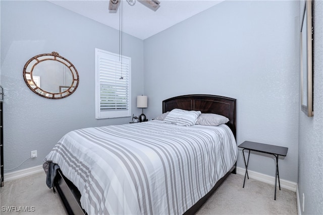 carpeted bedroom with lofted ceiling and ceiling fan