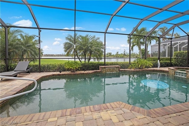 view of swimming pool featuring a patio area, a lanai, and an in ground hot tub