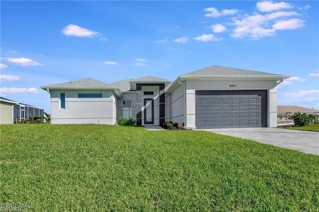 view of front of house featuring a garage and a front yard