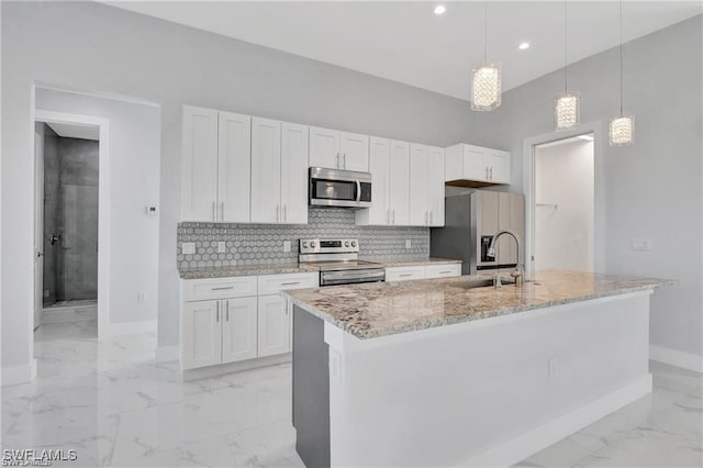 kitchen featuring pendant lighting, white cabinetry, and appliances with stainless steel finishes