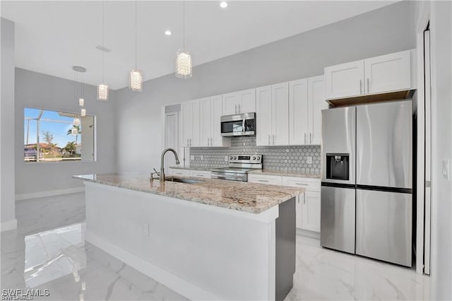 kitchen with white cabinetry, sink, a kitchen island with sink, and appliances with stainless steel finishes