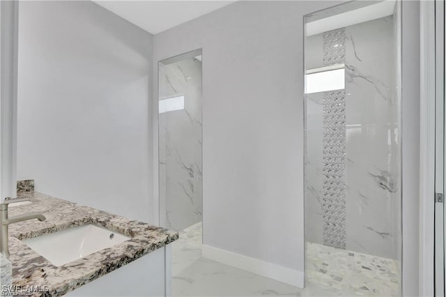 bathroom featuring vanity and a shower