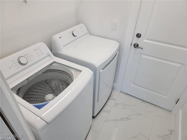 laundry room with independent washer and dryer