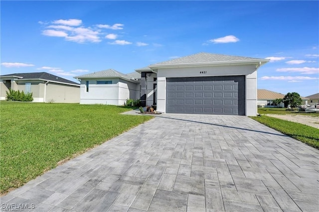 view of front of home featuring a garage and a front lawn