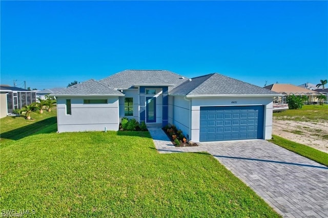 view of front of home featuring a garage and a front lawn