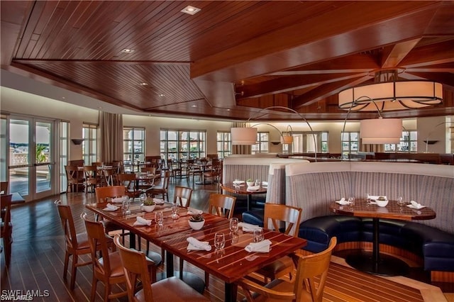 dining area with french doors and wood ceiling