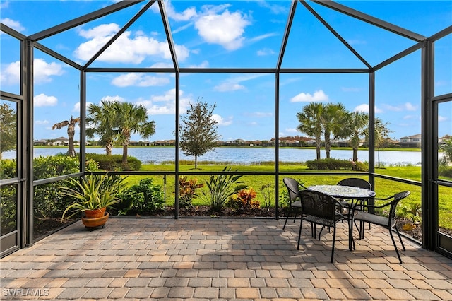 sunroom / solarium with a water view