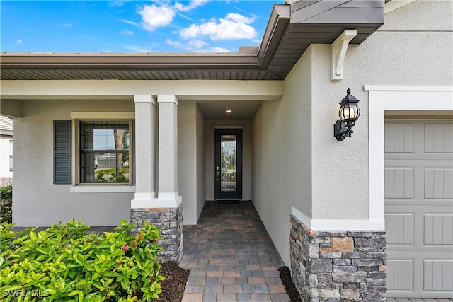 entrance to property featuring a garage