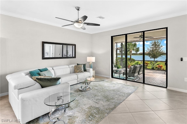 living room featuring ceiling fan, ornamental molding, and light tile patterned floors