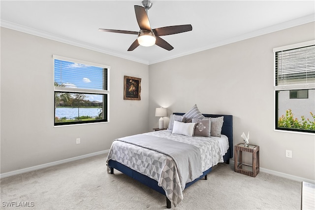 bedroom featuring carpet floors, ceiling fan, and crown molding