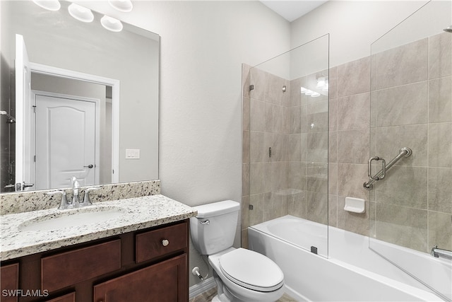 full bathroom featuring shower / bath combination with glass door, toilet, and vanity