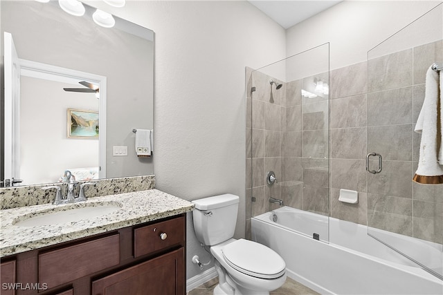 full bathroom featuring toilet, combined bath / shower with glass door, vanity, and ceiling fan