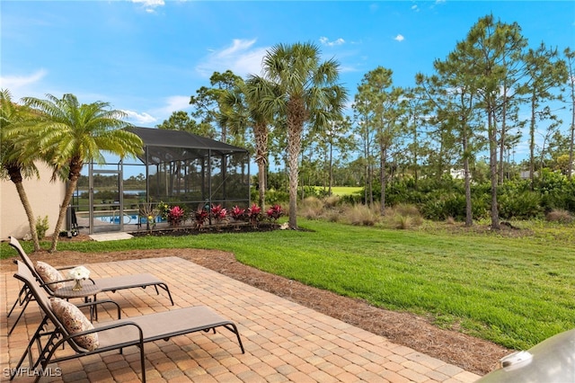 view of patio with glass enclosure