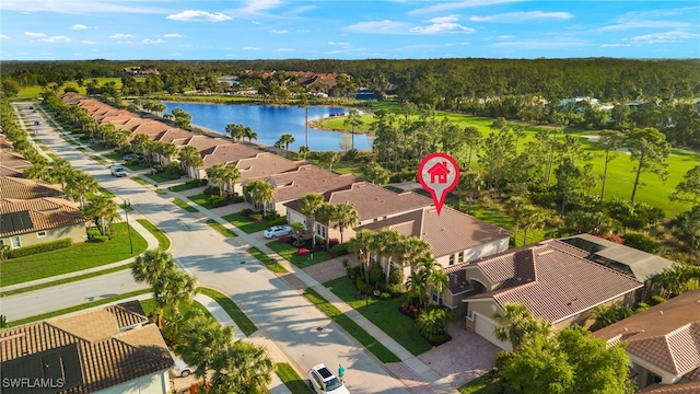 birds eye view of property with a water view