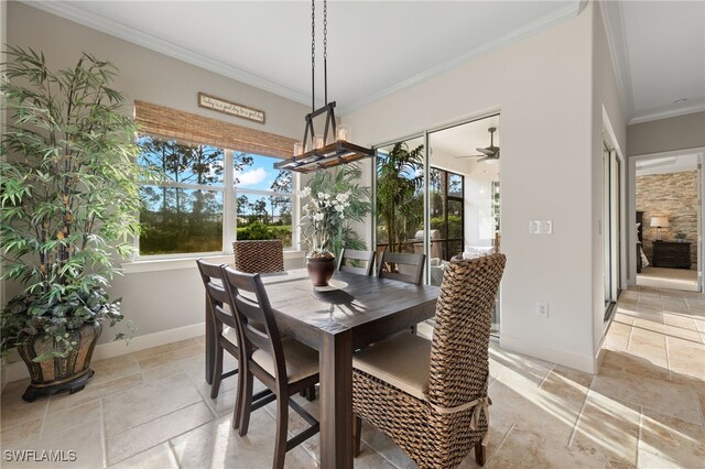 dining room featuring crown molding and ceiling fan