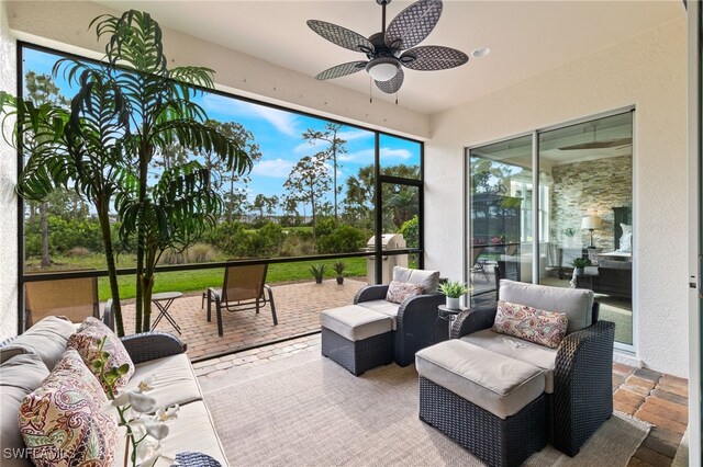 sunroom / solarium with ceiling fan