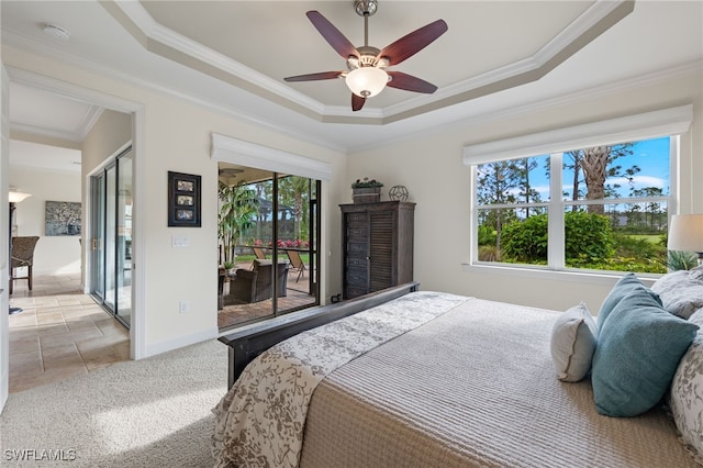 bedroom with access to exterior, a raised ceiling, ceiling fan, and crown molding