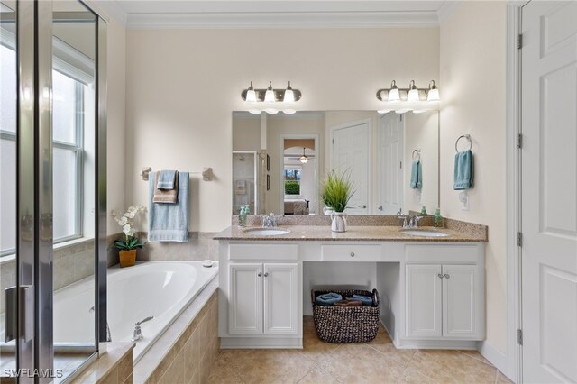 bathroom with tile patterned flooring, vanity, separate shower and tub, and ornamental molding