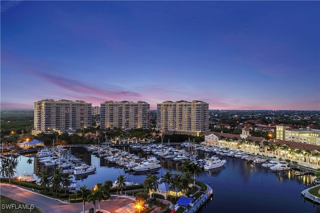 aerial view at dusk with a water view