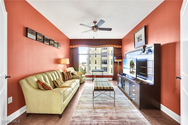 living room with hardwood / wood-style floors and ceiling fan