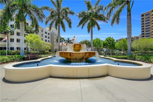 view of swimming pool with pool water feature