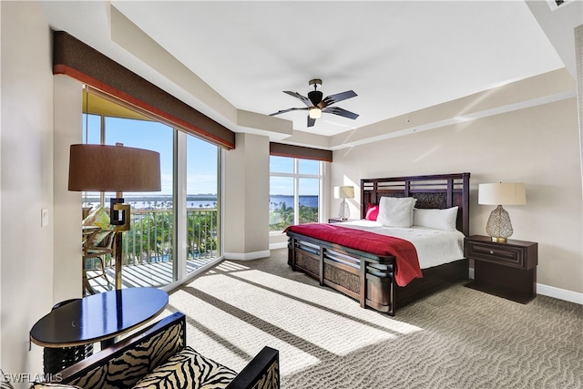 carpeted bedroom featuring ceiling fan and access to exterior