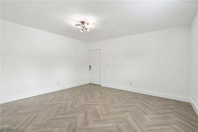 spare room featuring light parquet flooring