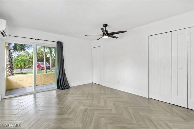 unfurnished bedroom featuring ceiling fan, access to exterior, and light parquet flooring