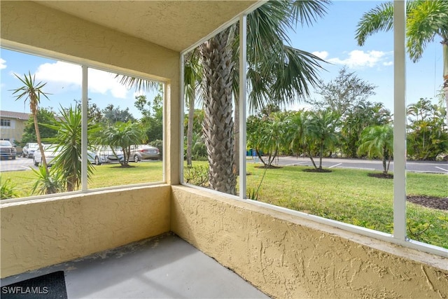 unfurnished sunroom featuring plenty of natural light