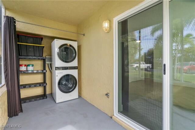 washroom with stacked washer and dryer