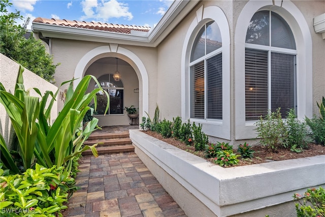 entrance to property featuring a wall mounted AC