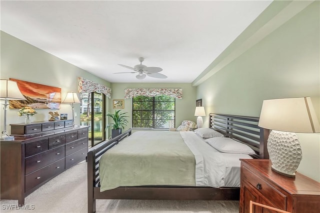 carpeted bedroom with a ceiling fan