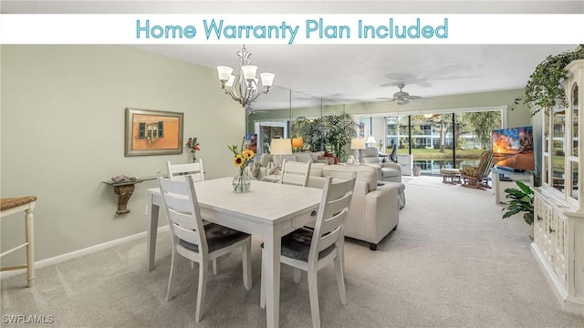 dining space featuring light carpet, a notable chandelier, and baseboards