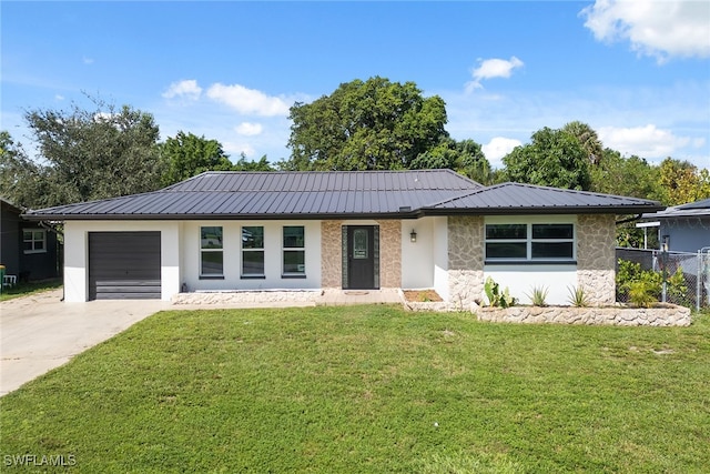 ranch-style home with a front lawn and a garage