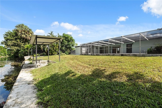 view of yard with glass enclosure