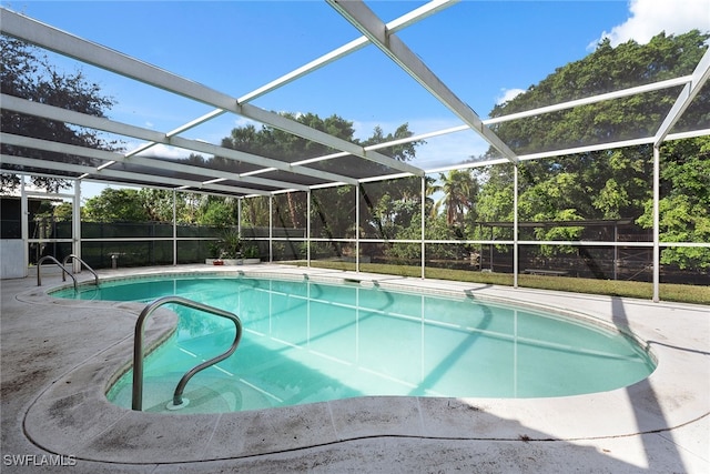 view of pool featuring a patio and a lanai