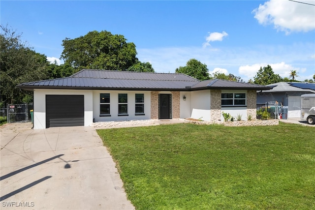 ranch-style house with a front yard and a garage