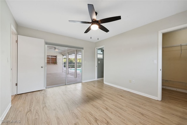 unfurnished bedroom with light hardwood / wood-style flooring, a closet, and ceiling fan