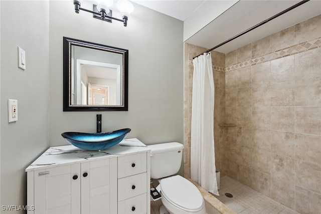 bathroom with vanity, a shower with shower curtain, and toilet