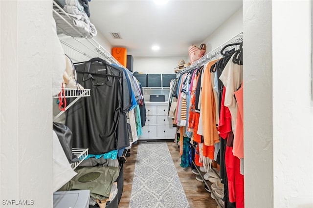 spacious closet featuring hardwood / wood-style floors