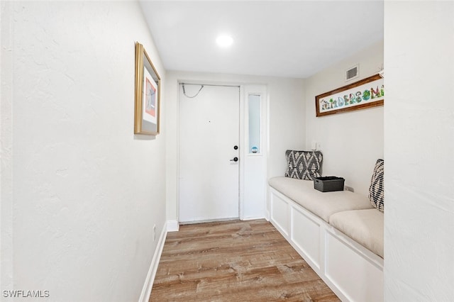 doorway to outside with light hardwood / wood-style flooring