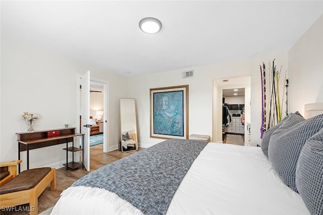 bedroom with wood-type flooring