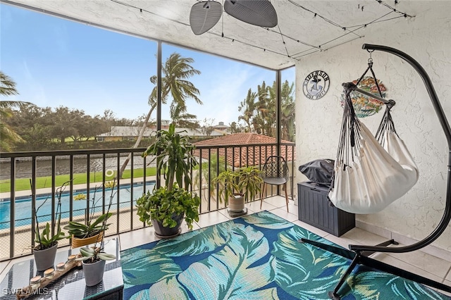 balcony featuring ceiling fan