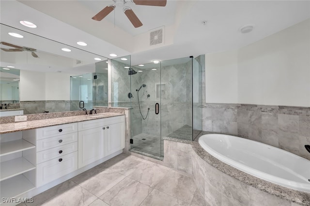 bathroom with vanity, independent shower and bath, and ceiling fan